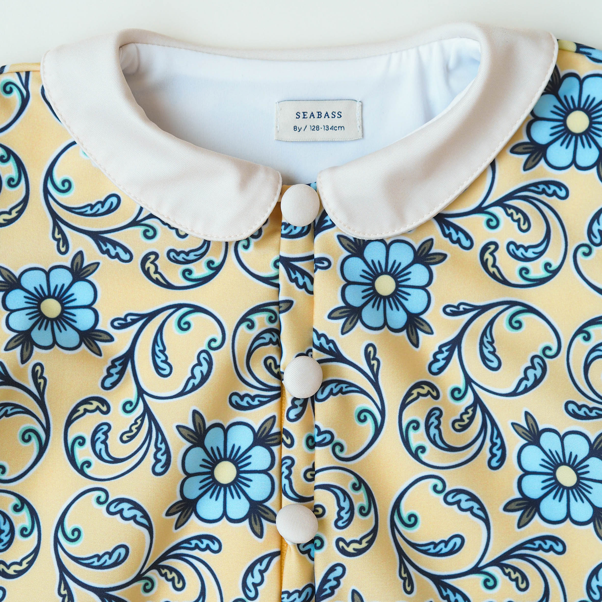 Meisje UV Badpak Coco Taormina - geel met blauwe bloemen